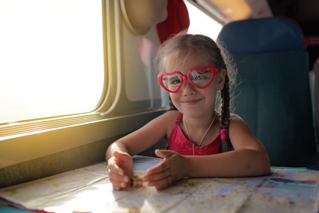 Young girl with pink glasses during summer vacation