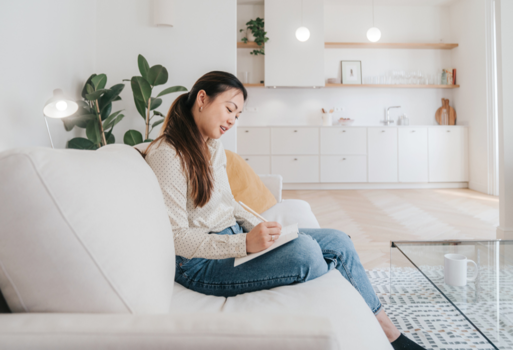 Woman journaling and doing a cbt exercise