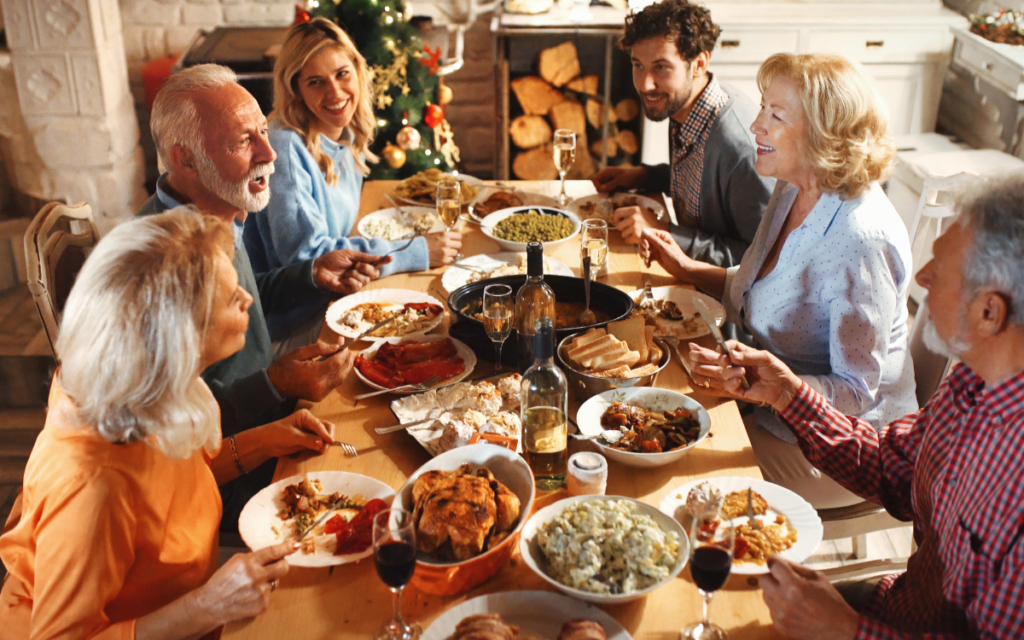 Family eating together at thanksgiving dinner table